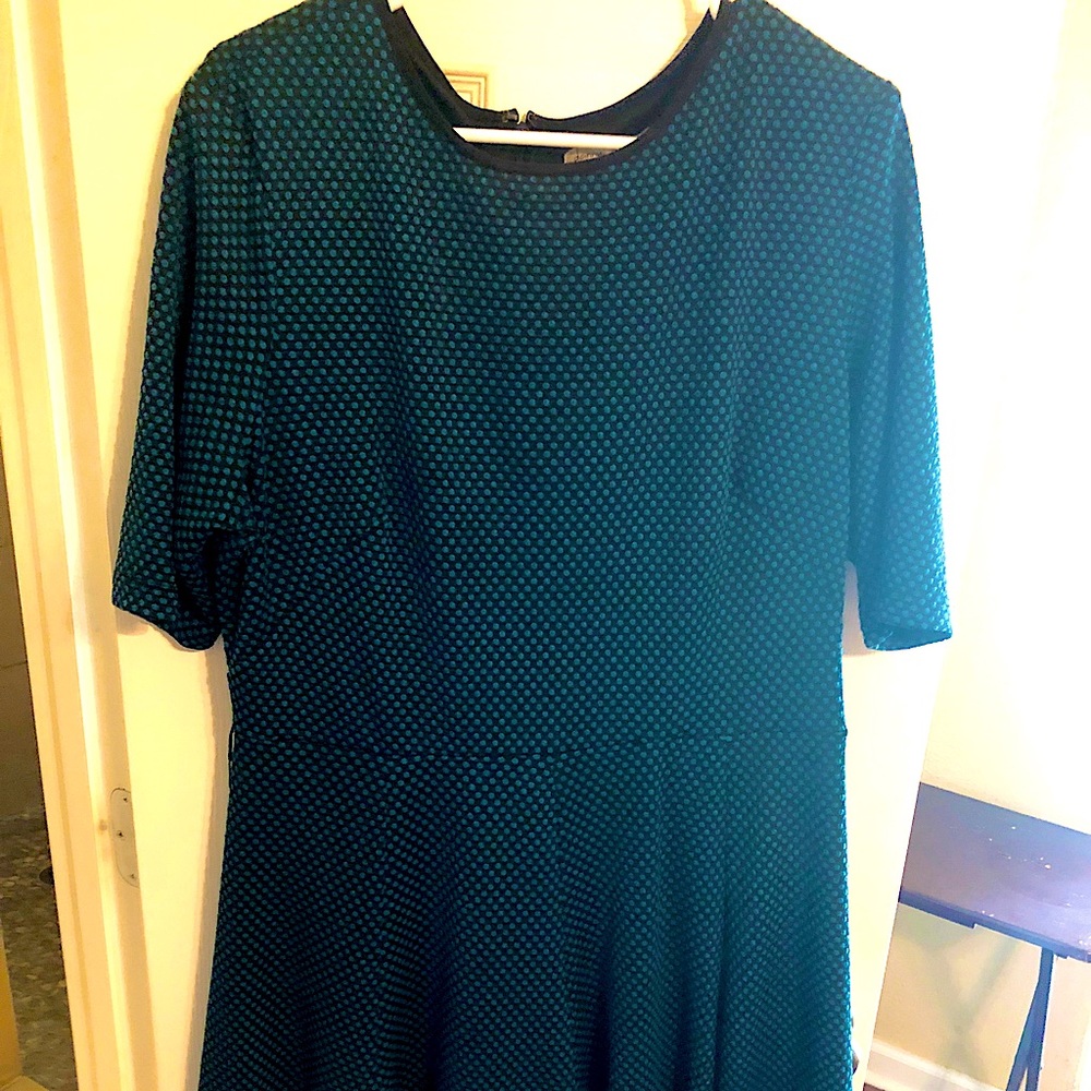 Knee length flowy bottom, 3/4 sleeve to elbow, black work or play dress.